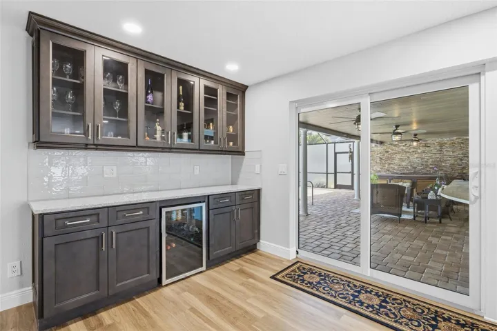 Bar/Service Area that makes entertaining efficient! Bar Refrigerator handles more than wine!