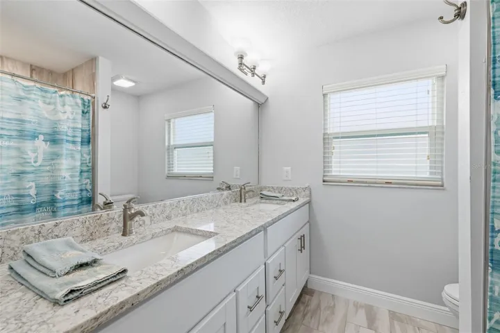 Guest Bathroom with Quartz Counters! Dual Sinks! plenty of Drawers and Cabinetry!