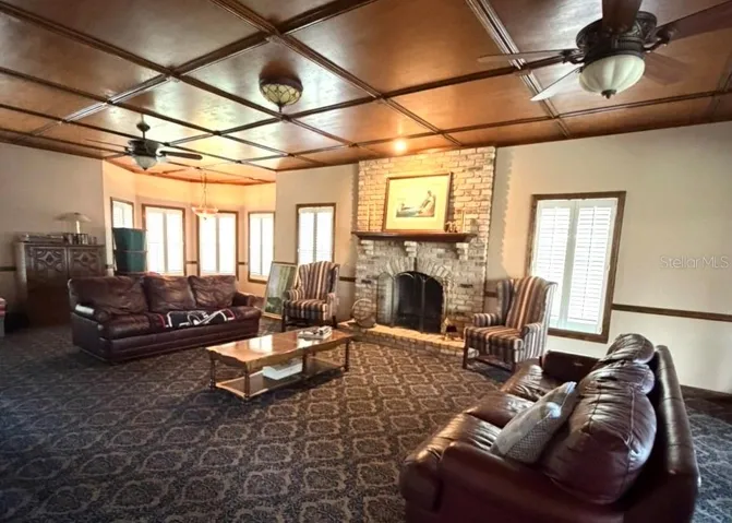 Huge great room w/paneled ceiling & fireplace