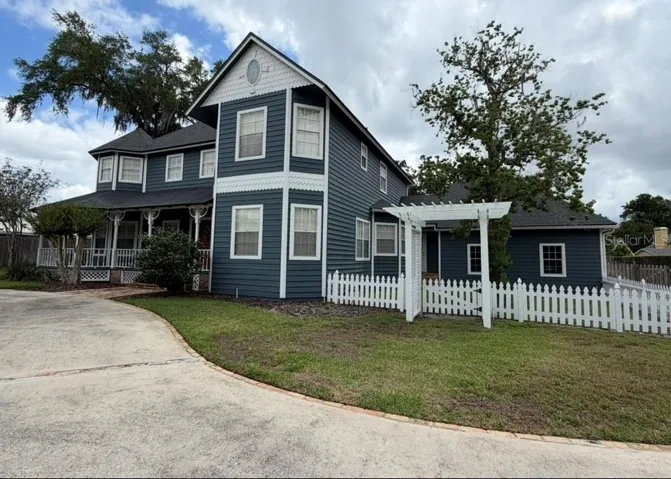 Fenced dog run or play yard on side