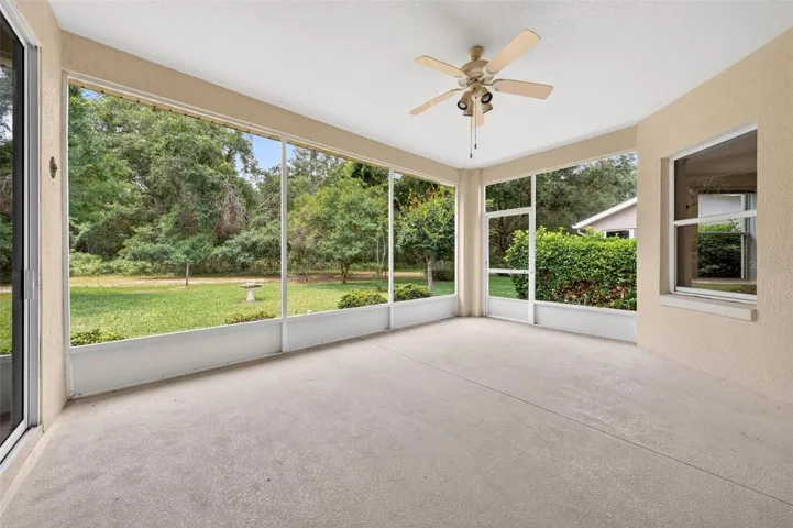 Covered screened porch with ceiling fan