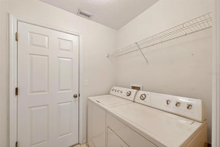 Indoor laundry room with garage access