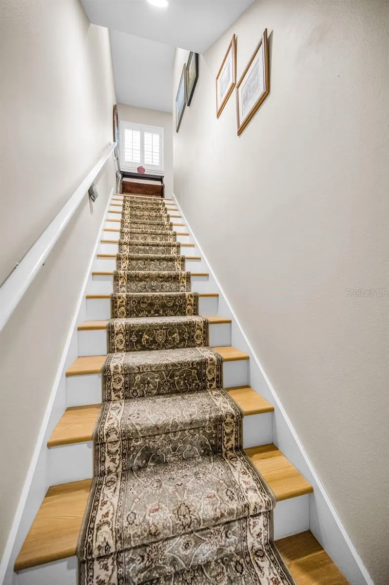 Entrance to your extra living space. The reinforced stair railing can accommodate a chair lift.