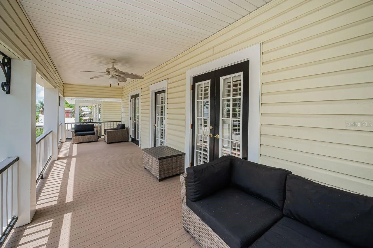 A main home balcony,  open, and full of quiet charm.
