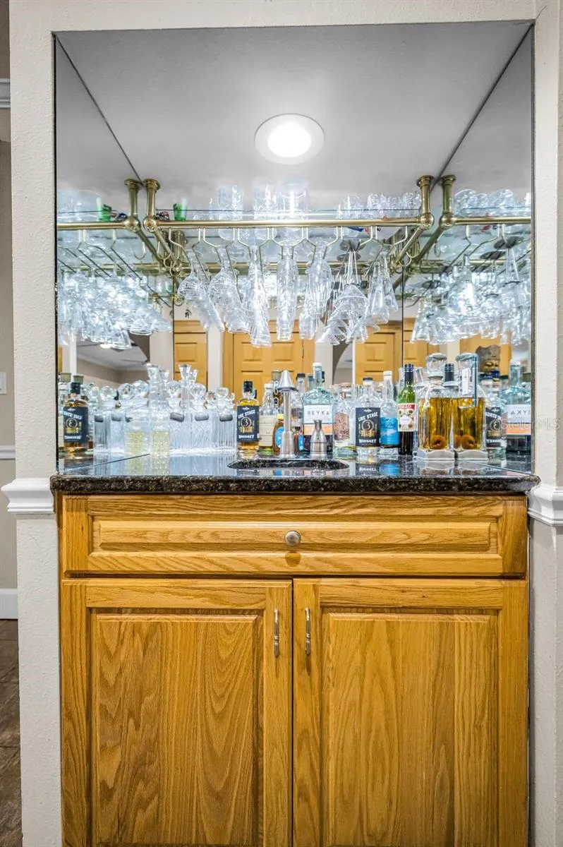 Separate wet bar directly off the kitchen.
