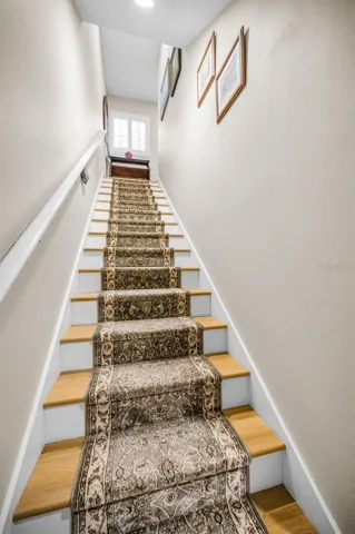 Entrance to your extra living space. The reinforced stair railing can accommodate a chair lift.