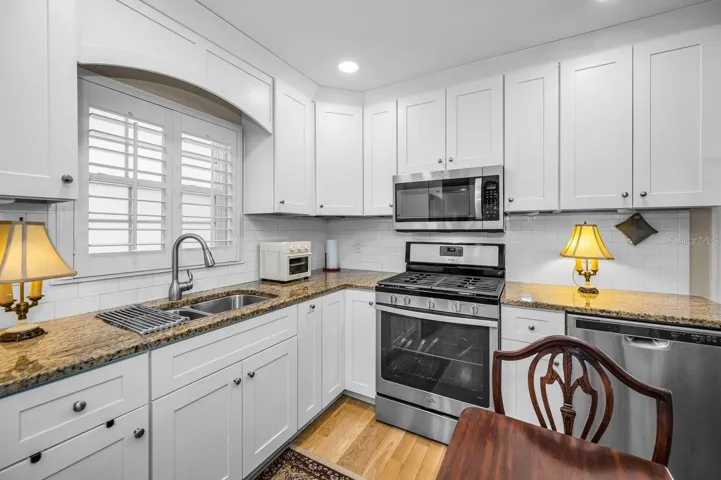 Spacious kitchen with gas appliances.