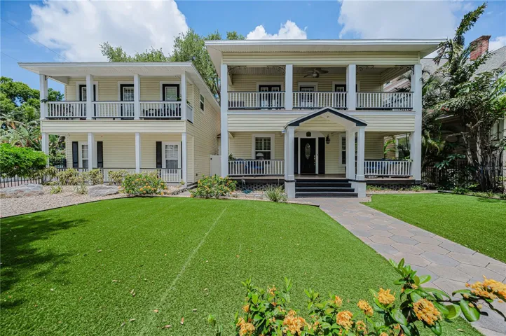 A front porch, an upper balcony, and a guest house with its own private balcony.