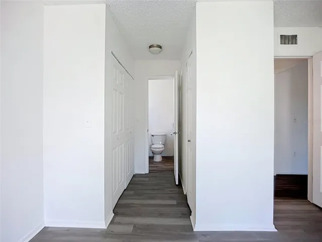 Lots of storage with two separate closets on both walls.