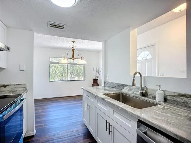 Easy access to the dining room with a pass through from the sink.