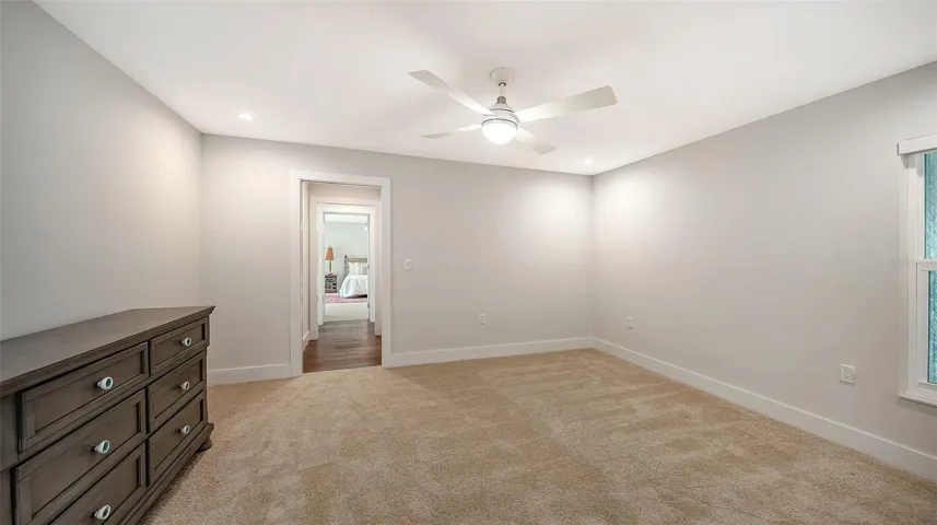Spacious west wing bedroom for family or guests.