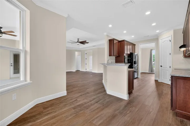 View from breakfast nook to kitchen and living area ~