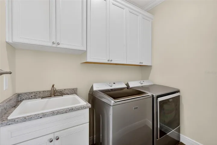 Interior laundry is 5'x7', includes Maytag washer and dryer, and convenient utility sink ~