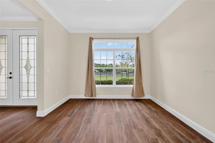 10'x11' dining area with a pocket door adjacent to kitchen ~