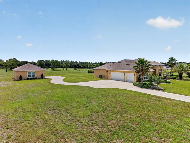 4+ acre homesite with multiple garage spaces ~