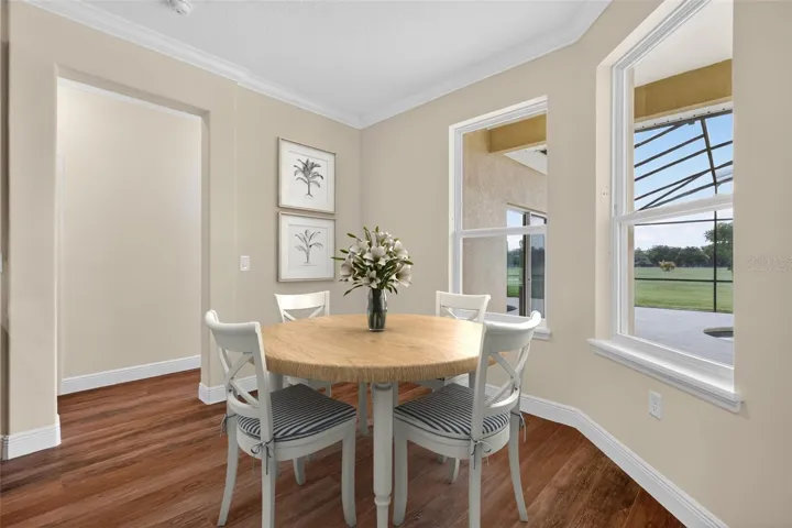 Virtually staged Breakfast nook 9'x10' with pool and back yard views ~