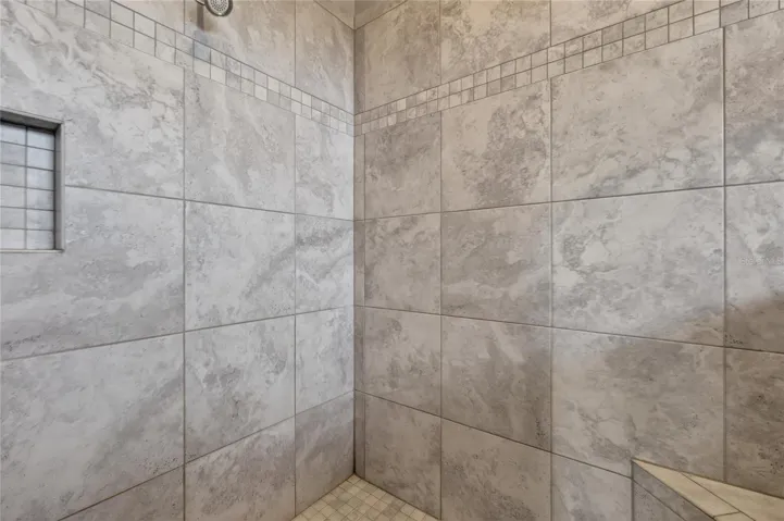 Tiled shower with bench and custom niche ~