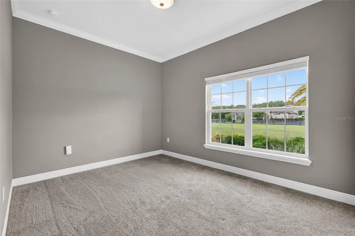 Bedroom 2 is 10'x12 and faces the front yard ~