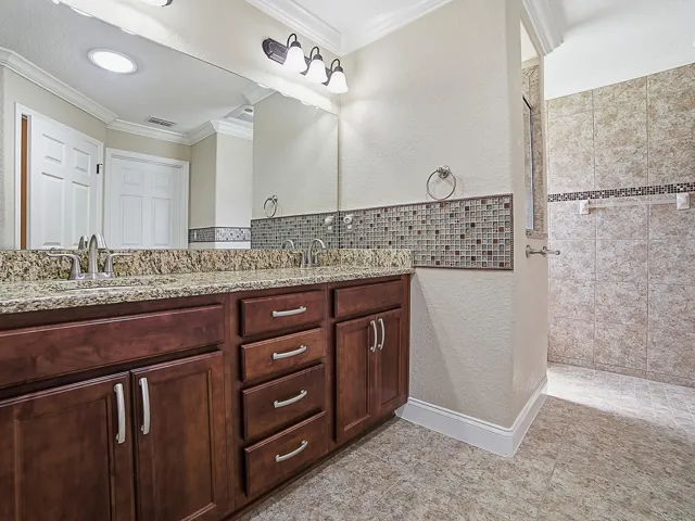 Primary Bathroom with Granite and Roman Shower