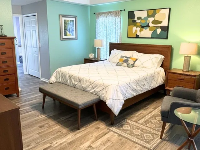 Virtually Staged Primary Bedroom with new luxury vinyl flooring