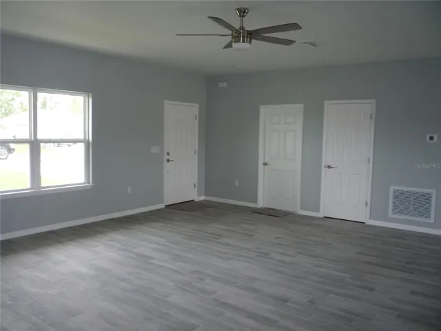 Living Room..light Gray walls with Gray Ceramic Tile Planks.