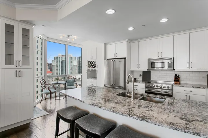 The kitchen features generous counter space, abundant storage, and stunning views that make every sunrise and sunset feel special.