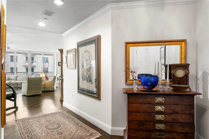The welcoming entry foyer offers ample wall space to showcase cherished family photos, artwork, or travel mementos, allowing you to personalize the space and make it your own
