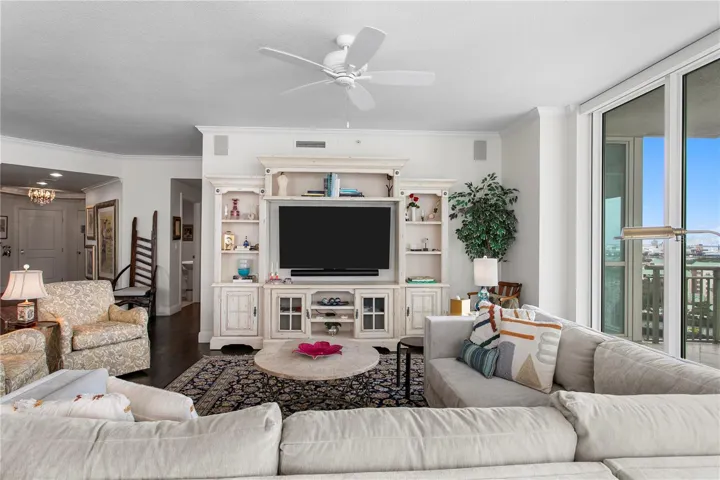 The spacious living room offers ample seating, creating the perfect gathering place to unwind after a long day or enjoy meaningful time with family and friends.