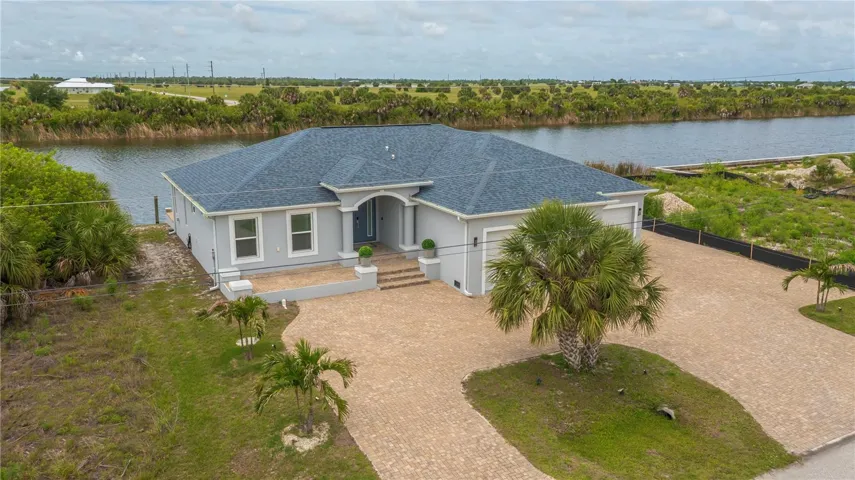 Sailboat-Access Waterfront Living and Exsoansive Paver Driveway.