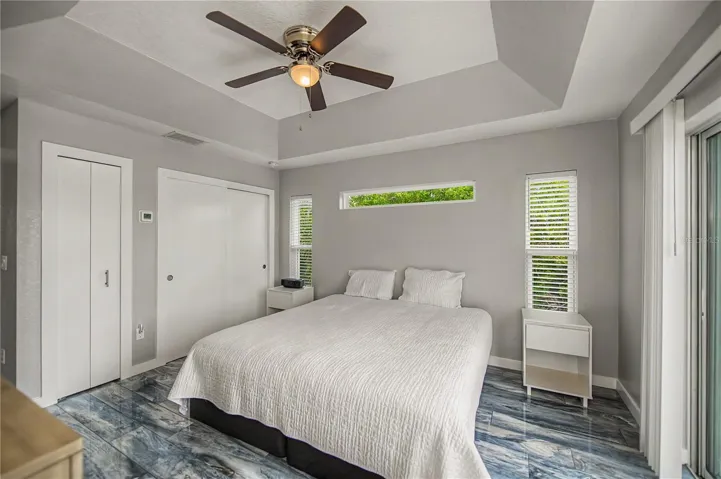 guest suite with patio access and convenient pass thru towel closet