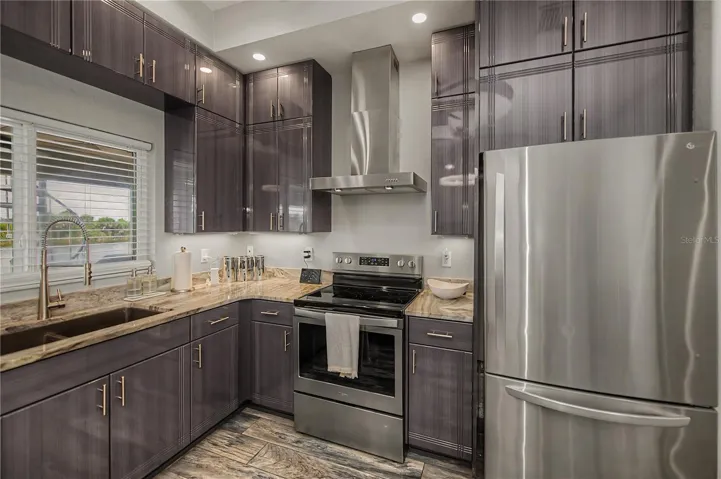Stainless Steel Appliances, Elegant Stone Countertops.
