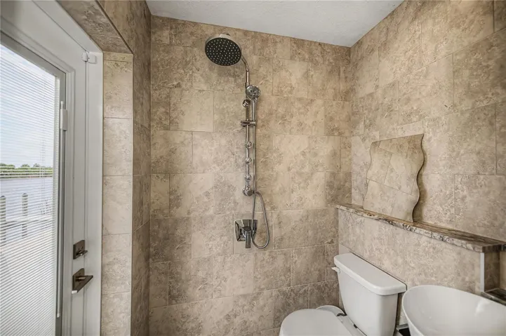 Patio Bathroom Featuring a Vessel Sink, Elegant Telework, and Contemporary Fixtures.