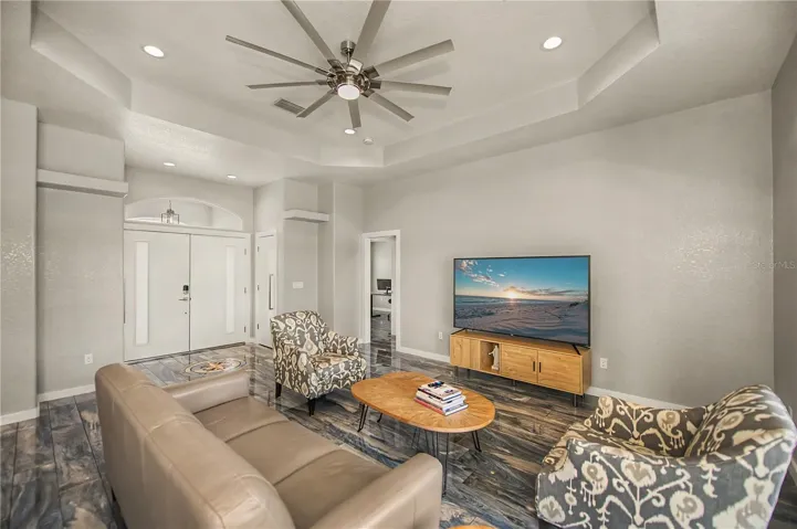 Living Rooms has Soaring Tray Ceilings, Designer Flooring, and an Open, Airy Feel.