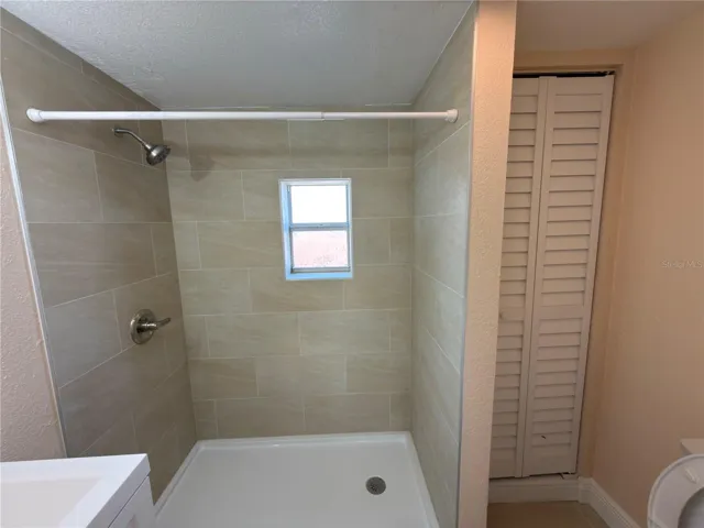 Bathroom With walk in shower and custom tiled