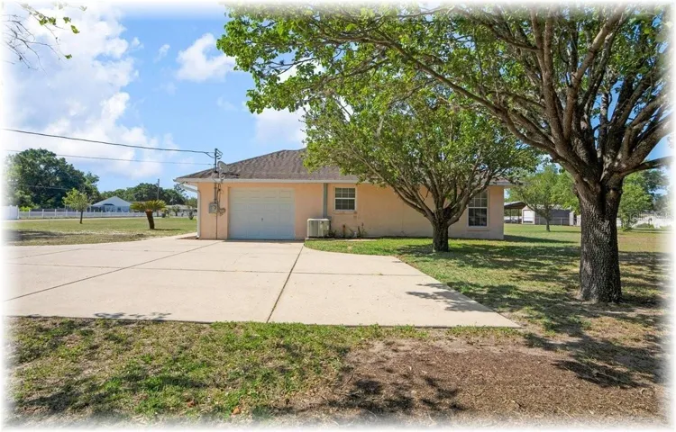 THIS 3/2 SPLIT HAS SIDE ENTRY GARAGE