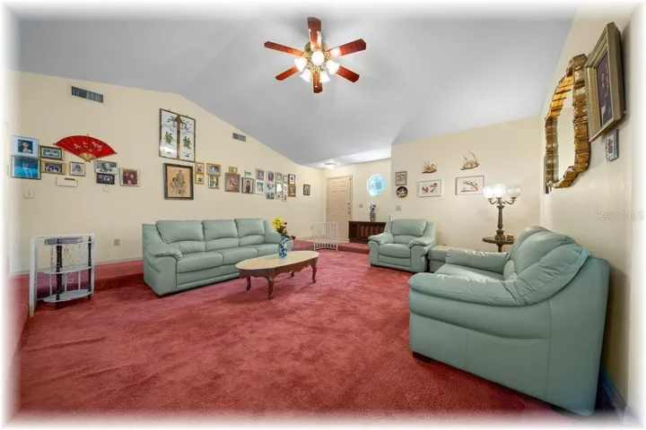 BRINGS YOU INTO LARGE FRONT LIVING RM