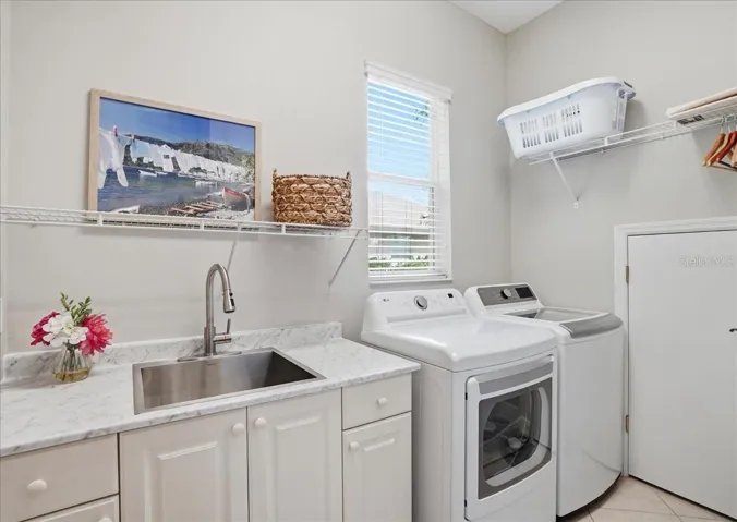 First Floor Laundry with Wet Sink and Under Stairs Storage