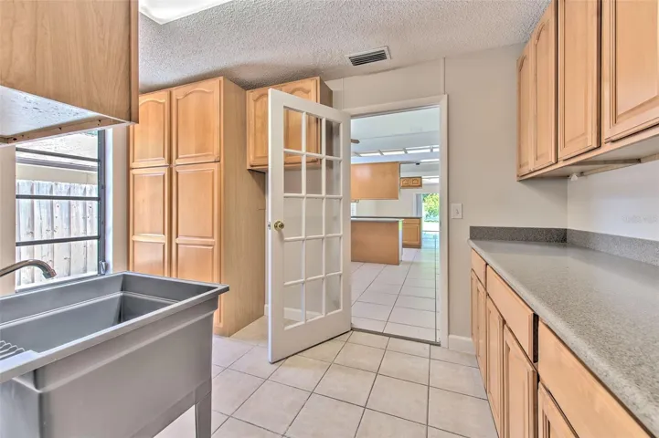 Large Inside Laundry Room between garage & kitchen