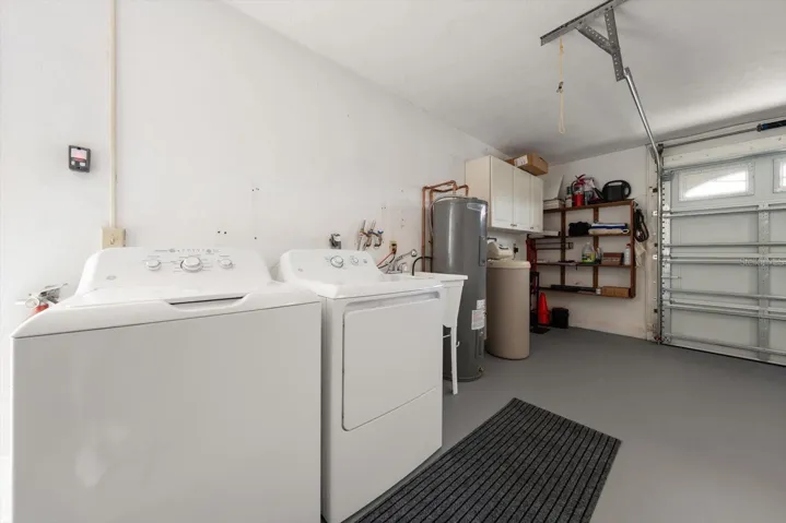 Brand new washer, dryer, water heater, garage door & opener. The garage also features additional storage shelving.
