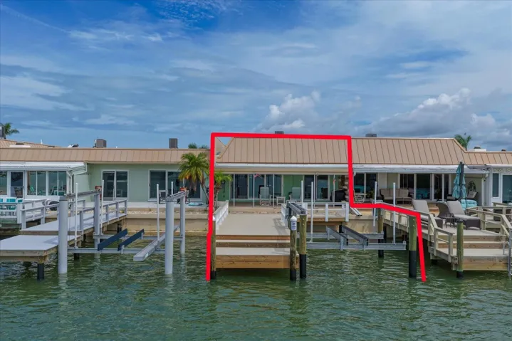 Waterfront paradise with private dock and 10,000 lb boat lift.