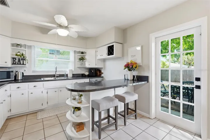 Bright and cheerful kitchen, door to backyard