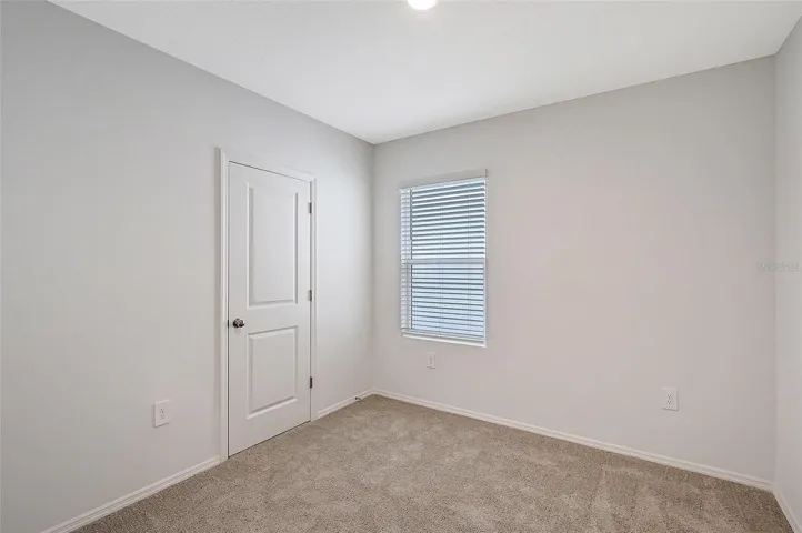 Versatile secondary bedroom ideal for guests, a home office, or growing families.