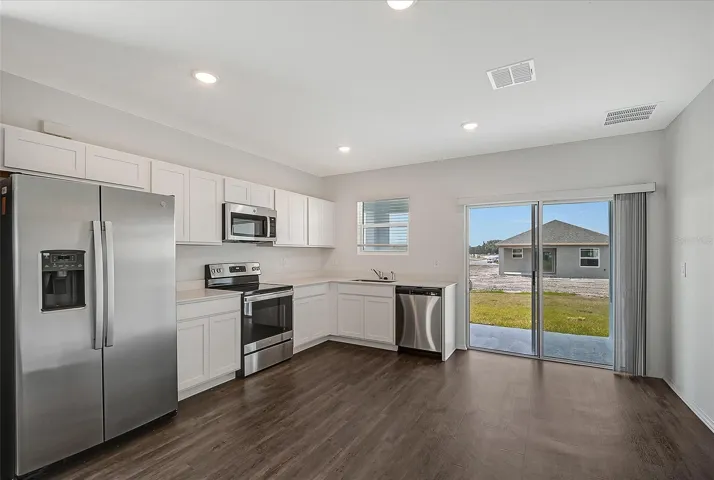 Open-concept living space seamlessly connecting the kitchen, dining, and great room - perfect for entertaining and everyday living.