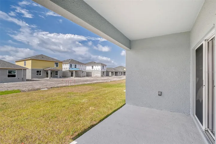 Covered lanai perfect for outdoor dining, morning coffee, and enjoying indoor-outdoor living.