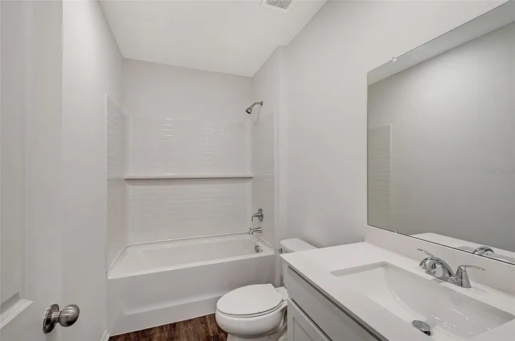 Well-appointed guest bathroom conveniently located near secondary bedroom.