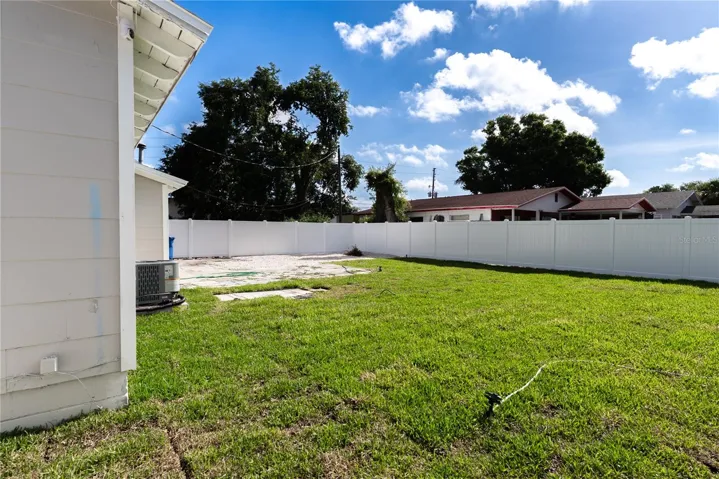 The fully fenced backyard offers a new watering system, and a brand new white vinyl privacy fence — plenty of space to create your own outdoor oasis.