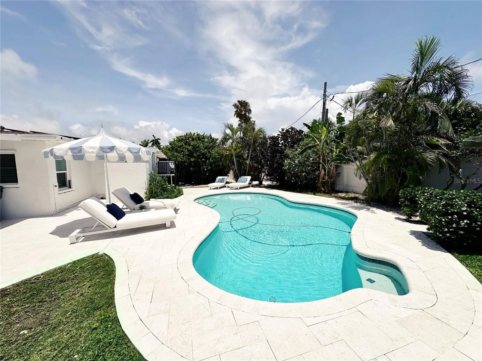 Pool area with pool sweeper