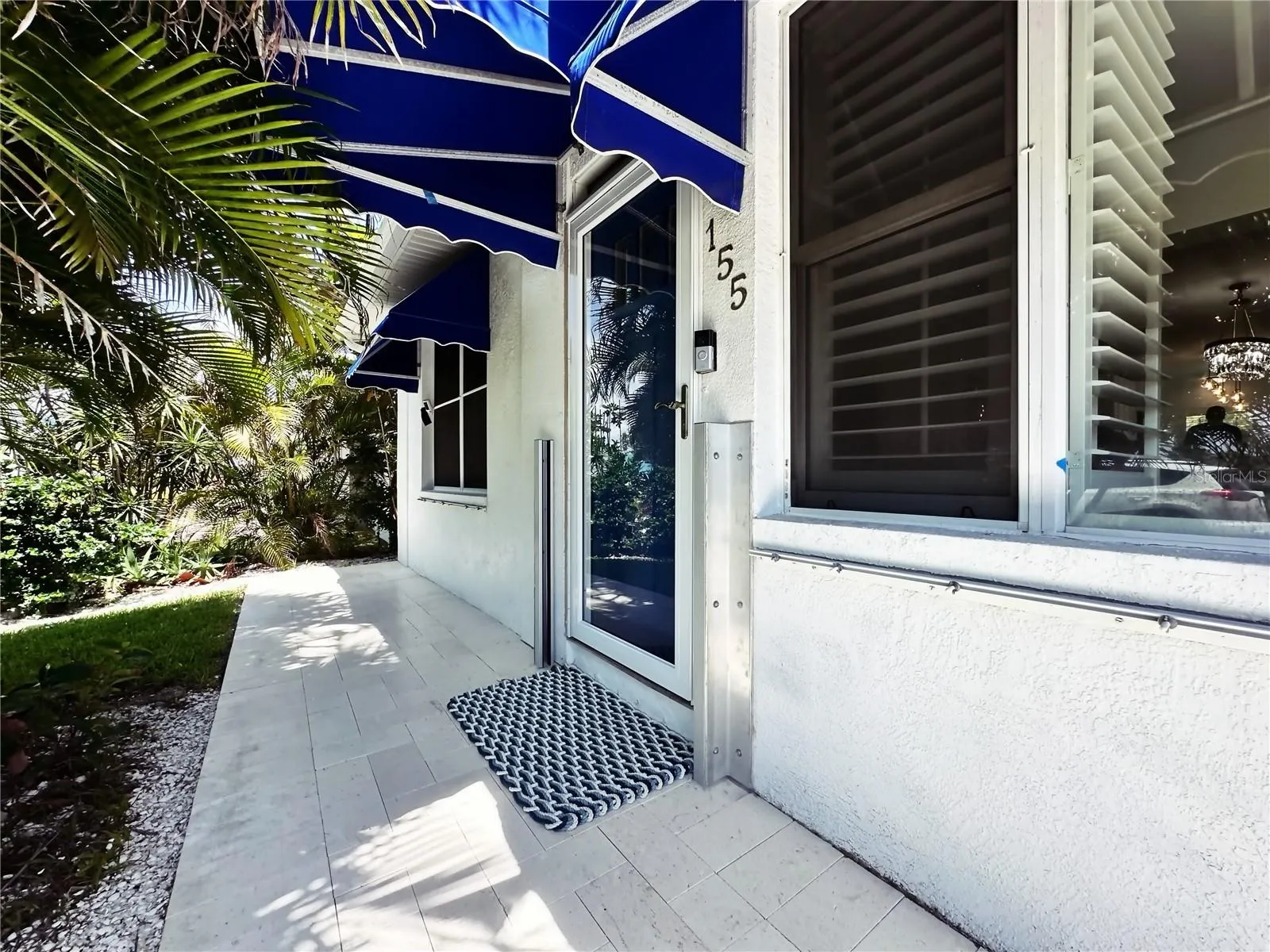 Front entrance. Note the flood gate brackets on the door.