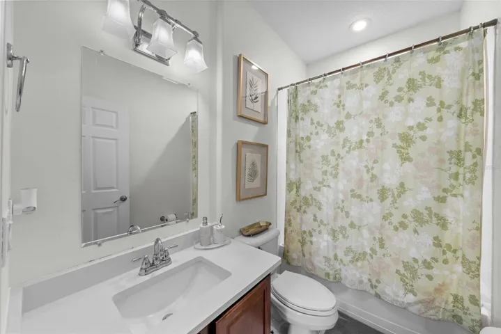 Full bath with tub/shower combination and updated vanity area.