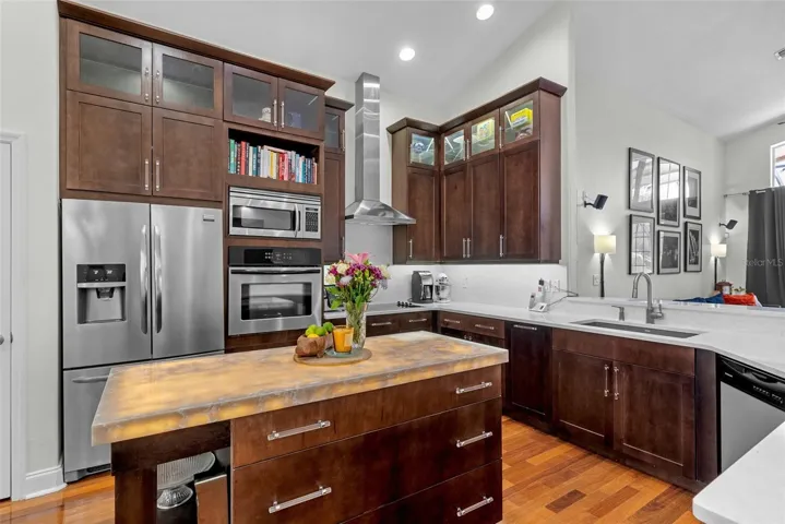 Spacious kitchen featuring built-in appliances and abundant cabinetry.